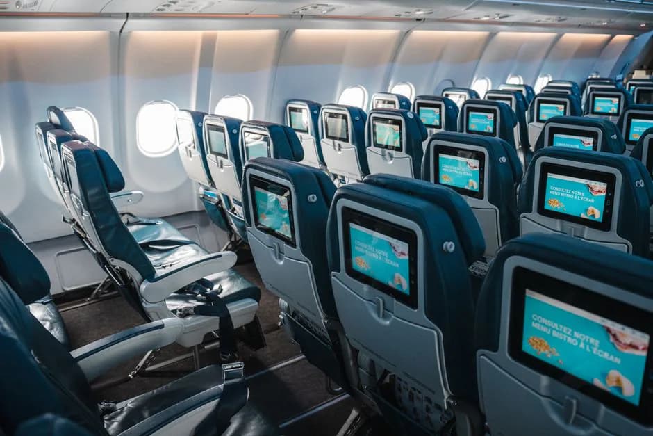 Air France economy cabin interior rows of seats on a Boeing 777-300ER long-haul flight