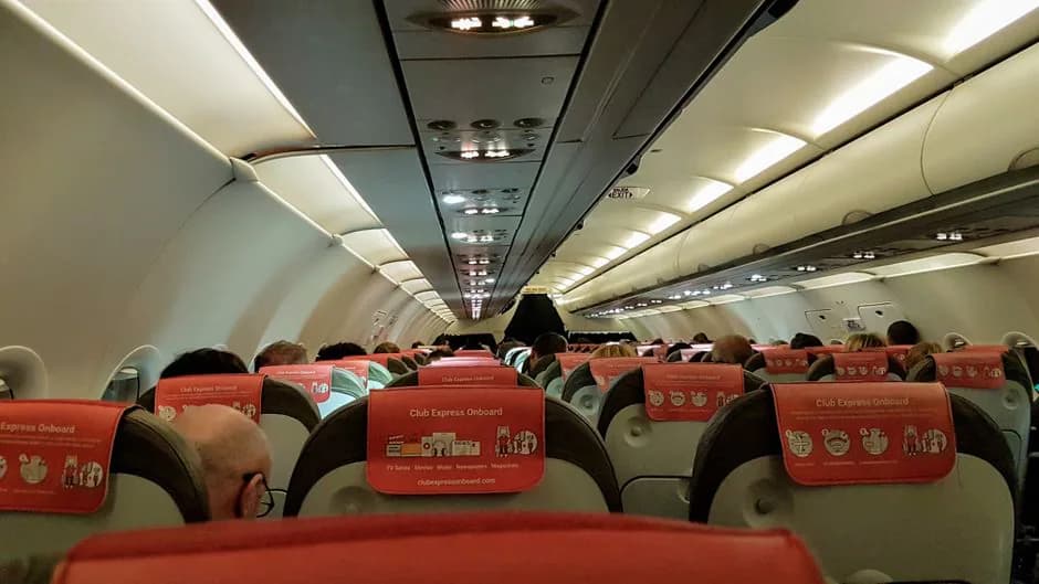 Japan Airlines 767-300 economy class cabin interior showing seat rows and overhead bins